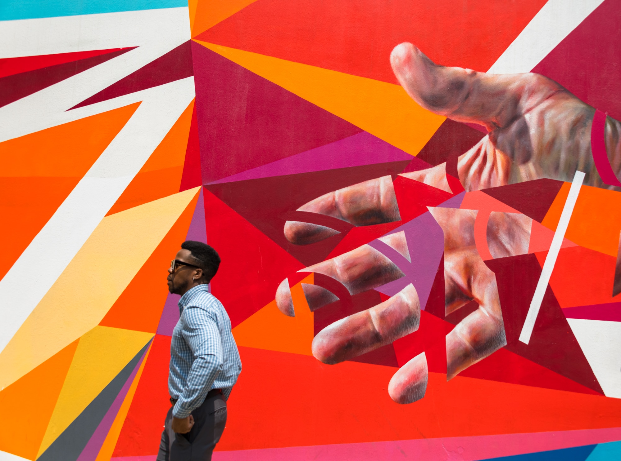 Person walking in front of street art in downtown Chicago